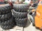 (4) NEW 12-16.5 YELLOW SKID STEER TIRES AND RIMS - ALL ONE PRICE
