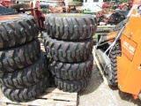 (4) NEW 12-16.5 YELLOW SKID STEER TIRES AND RIMS - ALL ONE PRICE