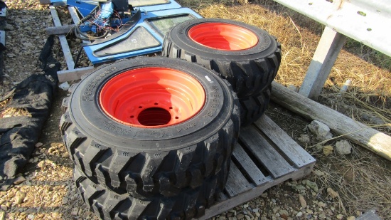 (4) NEW 10-16.5 SKID STEER TIRES ON ORANGE RIMS - ALL ONE PRICE