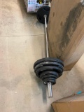 WEIGHT LIFTING BAR WITH WEIGHTED PLATES