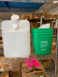 5 GALLON JUG WITH 4 SMALL PAILS AND WHITE SCOOP