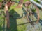 SMALLER SET OF STEEL WAGON WHEELS WITH AXLE
