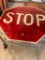STOP SIGN --- HOLES WHERE IT GOES INTO STEEL POST