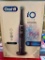 ORAL-B RECHARGEABLE TOOTH BRUSH WITH CHARGER, TRAVEL CASE, AND 2 BRUSH HEADS
