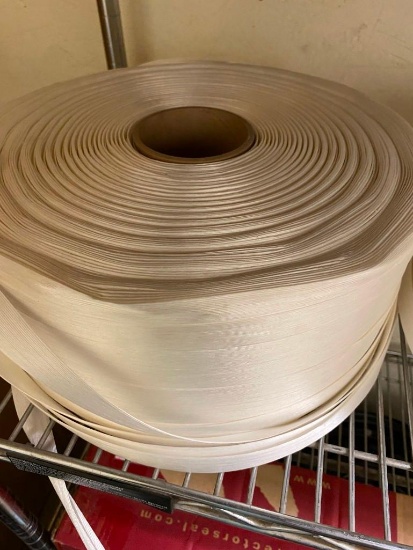 1 ROLL OF WHAT LOOKS LIKE SOME KIND OF PACKING STRAPPING