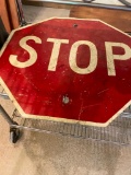STOP SIGN --- HOLES WHERE IT GOES INTO STEEL POST