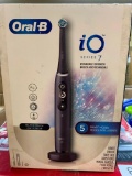 ORAL-B RECHARGEABLE TOOTH BRUSH WITH CHARGER, TRAVEL CASE, AND 2 BRUSH HEADS