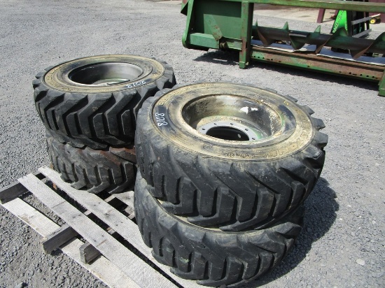 4) 12-16.5 TIRES & RIMS