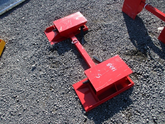 RED WELD ON SKIDSTEER ATTACHER