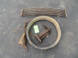 Car jack, rim, grill