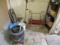 Contents of Corner, Chairs, Shop Vac Hose, Misc