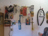 Contents of wall - tools on pegboard, saw blades