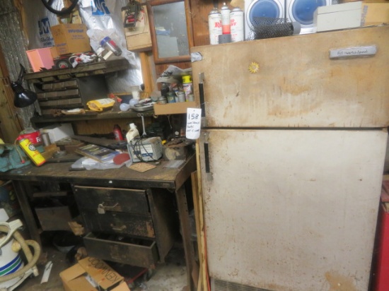 Contents of east wall - refrigerator, workbench, etc.