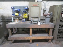 Wooden workbench with grinders