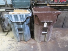 (2) trash cans with wood blocks