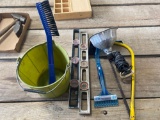 Levels, saw, bucket, heat lamp