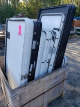Wooden crate of Lippert RV baggage door assemblies.