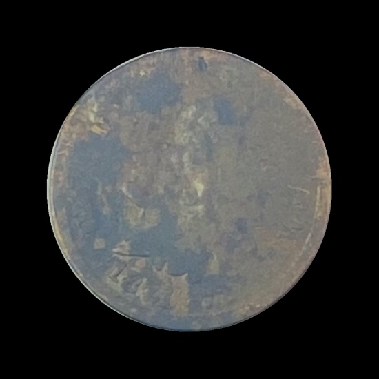 The coin appears to be a heavily corroded U.S. Shield Nickel but the year and mint mark are not visi