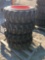 (4) SKS-1 10-16.5 N.H.S Skid Steer Tires on Bobcat Wheels