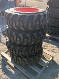 (4) SKS-1 10-16.5 N.H.S Skid Steer Tires on Bobcat Wheels