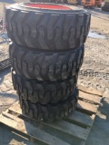 (4) SKS-1 12-16.5 N.H.S Skid Tires on Bobcat Wheels
