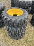 (4) Forerunner 10-16.5 Skid Steer tires w/ NH, JD, CAT rims