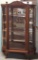 Golden Oak Bow front China Cabinet with Mirror Back Panels