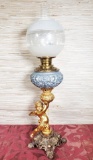 Metal figural cherub base oil lamp
