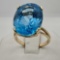 10K Yellow Gold Ring With 20 Carat Oval Mixed Cut Blue Topaz