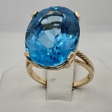 10K Yellow Gold Ring With 20 Carat Oval Mixed Cut Blue Topaz