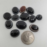 Lapidarian Collection Of 12 Cabochon Bulls Eye Agate