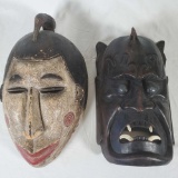 2 Hard Carved Ethnic Masks