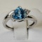 14 K White Gold And Trillion Cut Topaz Flanked by 4 Small Clear Topaz