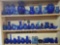 3 Shelves full of Cobalt Glass Vases, Pitchers, Bowls and More