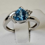 14 K White Gold And Trillion Cut Topaz Flanked by 4 Small Clear Topaz