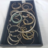 A Collection Of 19th / 20th Century African 21 Metal Currency Bracelets & 1 Choker