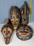 4 Hand Carved African Masks from Ghana Showing Varied Traditional Styles and Shapes