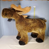 Whimsical Baby Moose on all Fours Sit On Stuffed Animal