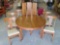 Round Oak Dining Table With 3 Leaves and 4 Chairs
