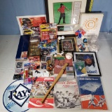 Tray Lot of Mixed Era Sports Programs. Figurines, and Related Memorabilia