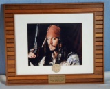 Johnny Depp Autographed Photo in Ship Work Style Frame & Pirates of The Caribbean Prop Coin