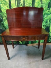 Antique Federal style flip top card table featuring elegant mahogany veneer and detailed satinwood