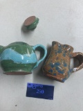Two hand made clay items, pitcher and teapot