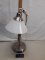 white shade and chrome table lamp