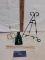 green glass bottle with stopper, plate easel