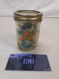 small mason jar of marbles