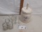 ceramic canister with tall handled lid, shot glasses, small glass jars