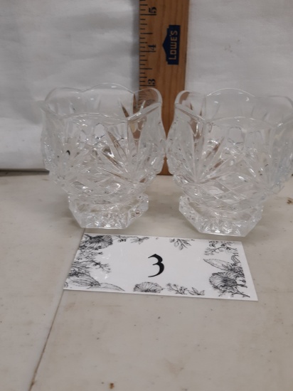 two pressed glass votive holders