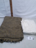 Lace curtain and woven afghan