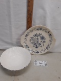 blue and white round platter and white swirl serving bowl with silver rim